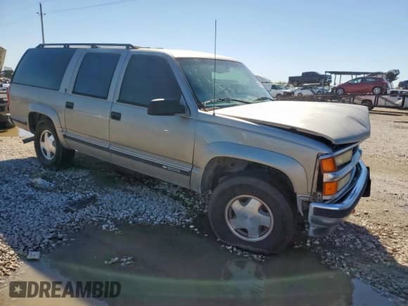 1999 Chevrolet Suburban z VIN 1GNFK16R7XJ571867, wystawiony jako Copart lot #90450425 z przebiegiem 294 487 mil mil oraz Szkoda całkowita • Salvage title. Historia ofert i sprzedaży dostępna na DreamBid. Obrazek 4.