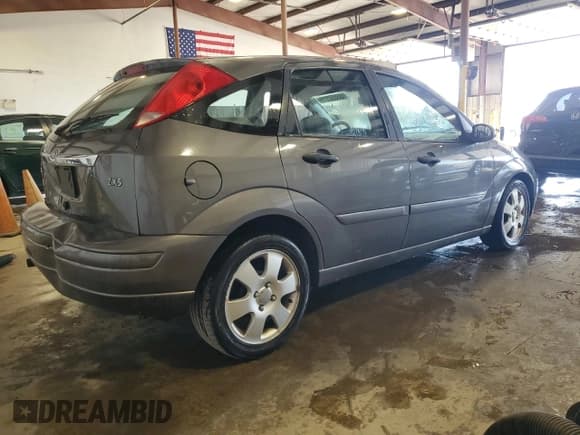 ✅ 2002 Ford Focus ZX5 • VIN: 3FAFP37352R180981 • Lot: 55856125. Listed on Copart with 59,785 mi. Free auction sales archive from the USA and detailed vehicle history report at DreamBid. Image 3.