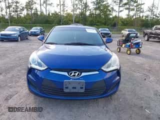 2016 Hyundai Veloster z VIN KMHTC6AD7GU285495, wystawiony jako IAAI lot #43461787 z przebiegiem 152 557 mil mil oraz . Historia ofert i sprzedaży dostępna na DreamBid. Obrazek 6.