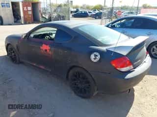 2005 Hyundai Tiburon GS z VIN KMHHM65D65U157713, wystawiony jako IAAI lot #42039826 z przebiegiem 184 368 mil mil oraz . Historia ofert i sprzedaży dostępna na DreamBid. Obrazek 3.