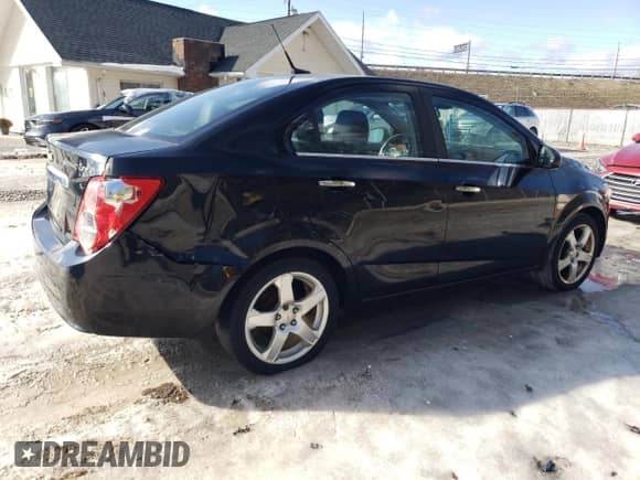 2012 Chevrolet Sonic LTZ с VIN 1G1JE5SH3C4149210, выставлен на аукционе Copart как лот 61470005 с пробегом 166 902 миль миль и Списание • Salvage title. История ставок и продаж доступна на DreamBid. Изображение 3.