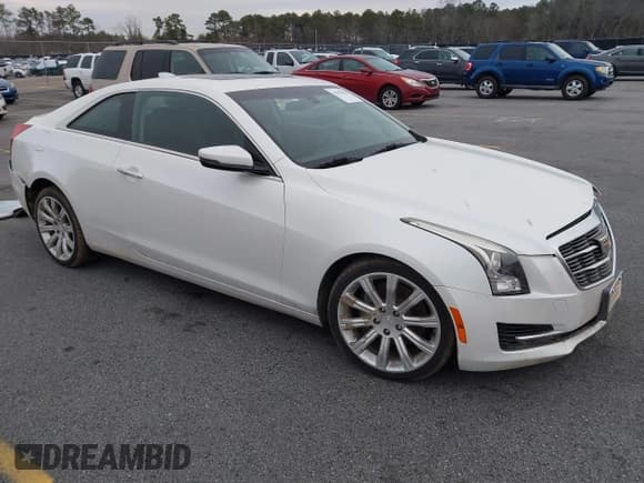 ✅ 2015 Cadillac ATS Standard AWD • VIN: 1G6AG1RX0F0127073 • Lot: 41296448. Listed on IAAI with 119,718 mi. Free auction sales archive from the USA and detailed vehicle history report at DreamBid. Image 1.