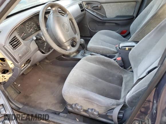 2003 Hyundai Elantra GLS z VIN KMHDN45D53U572664, wystawiony jako Copart lot #82387214 z przebiegiem Nie podano mil oraz Szkoda całkowita • Salvage title. Historia ofert i sprzedaży dostępna na DreamBid. Obrazek 7.