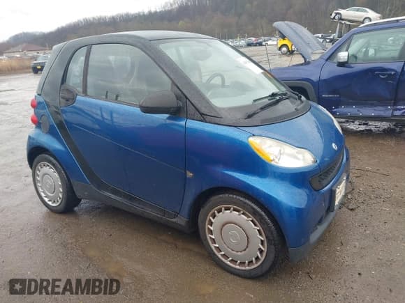 ✅ 2009 Smart fortwo Pure • VIN: WMEEJ31X69K312553 • Lot: 41957660. Listed on IAAI with 156,476 mi. Free auction sales archive from the USA and detailed vehicle history report at DreamBid. Image 1.