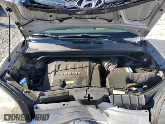 2007 Hyundai Tucson SE with VIN KM8JN72D07U606685, listed as a Copart auction lot 87243795 with 158,114 mi miles and Salvage title. Bid and sale history available at DreamBid. Image 12.
