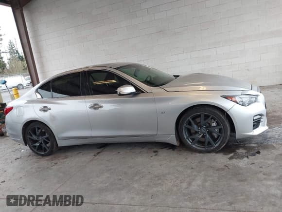 ✅ 2015 Infiniti Q50 Premium • VIN: JN1BV7AP3FM335210 • Lot: 43711853. Listed on IAAI with 102,947 mi. Free auction sales archive from the USA and detailed vehicle history report at DreamBid. Image 14.