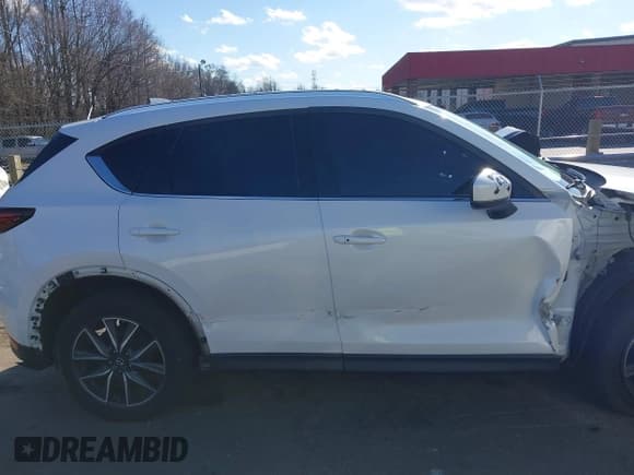 ✅ 2018 Mazda CX-5 Grand Touring • VIN: JM3KFBDM6J0435579 • Лот: 41208899. Опубликован ранее на IAAI с пробегом 131 212 миль. Бесплатный доступ к архиву аукционных продаж из США и подробный отчёт об истории автомобиля на DreamBid. Изображение 14.