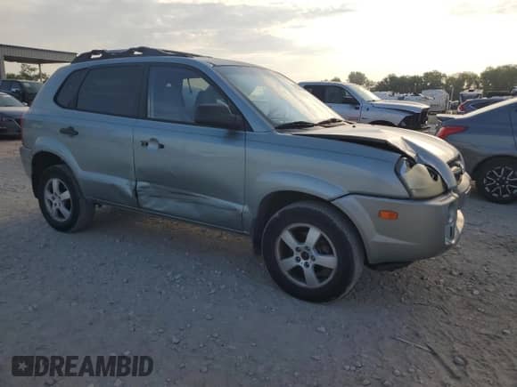 2006 Hyundai Tucson GL with VIN KM8JM12B86U411849, listed as a Copart auction lot 69301264 with 125,056 mi miles and Salvage title. Bid and sale history available at DreamBid. Image 4.
