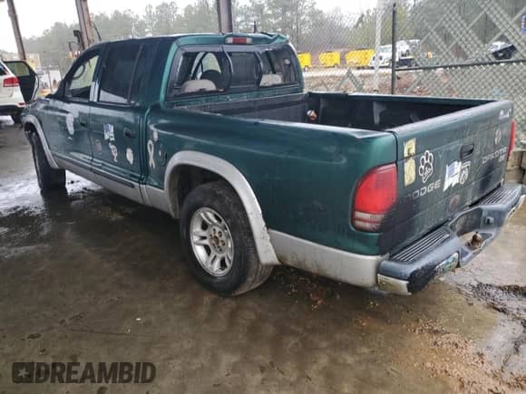 2003 Dodge Dakota SLT z VIN 1D7HL48X03S261436, wystawiony jako Copart lot #42317965 z przebiegiem 136 380 mil mil oraz Szkoda całkowita • Salvage title. Historia ofert i sprzedaży dostępna na DreamBid. Obrazek 2.