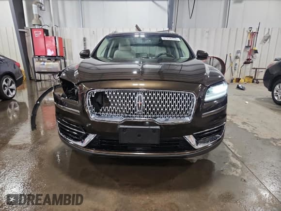 ✅ 2019 Lincoln Nautilus Reserve • VIN: 2LMPJ8L97KBL25122 • Лот: 67236405. Опубликован ранее на Copart с пробегом 74 654 миль. Бесплатный доступ к архиву аукционных продаж из США и подробный отчёт об истории автомобиля на DreamBid. Изображение 5.