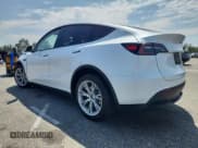 ✅ 2023 Tesla Model Y Long Range • VIN: 7SAYGDEE5PA036191 • Lot: 65167315. Listed on Copart with 30,462 mi. Free auction sales archive from the USA and detailed vehicle history report at DreamBid. Image 2.