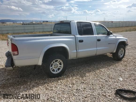 2002 Dodge Dakota Sport z VIN 1B7HG38N02S691280, wystawiony jako Copart lot #66309924 z przebiegiem 227 327 mil mil oraz Czysty tytuł • Clean title. Historia ofert i sprzedaży dostępna na DreamBid. Obrazek 3.