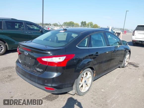 ✅ 2014 Ford Focus Titanium • VIN: 1FADP3J23EL237429 • Lot: 43358765. Listed on IAAI with 138,960 mi. Free auction sales archive from the USA and detailed vehicle history report at DreamBid. Image 4.