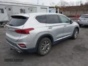 ✅ 2019 Hyundai Santa Fe SE • VIN: 5NMS2CAD7KH054274 • Lot: 43694931. Listed on IAAI with 96,329 mi. Free auction sales archive from the USA and detailed vehicle history report at DreamBid. Image 4.