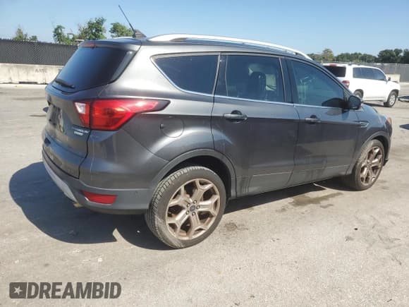 ✅ 2019 Ford Escape Titanium • VIN: 1FMCU0J98KUB99210 • Lot: 89847885. Listed on Copart with 97,586 mi. Free auction sales archive from the USA and detailed vehicle history report at DreamBid. Image 3.