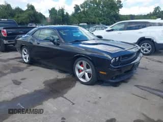 2010 Dodge Challenger SRT-8 z VIN 2B3CJ7DW1AH208758, wystawiony jako IAAI lot #43107005 z przebiegiem 83 052 mil mil oraz . Historia ofert i sprzedaży dostępna na DreamBid. Obrazek 1.
