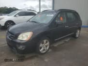 ✅ 2007 Kia Rondo EX • VIN: KNAFG526677042238 • Лот: 70869634. Опубликован ранее на Copart с пробегом 152 464 миль. Бесплатный доступ к архиву аукционных продаж из США и подробный отчёт об истории автомобиля на DreamBid. Изображение 1.