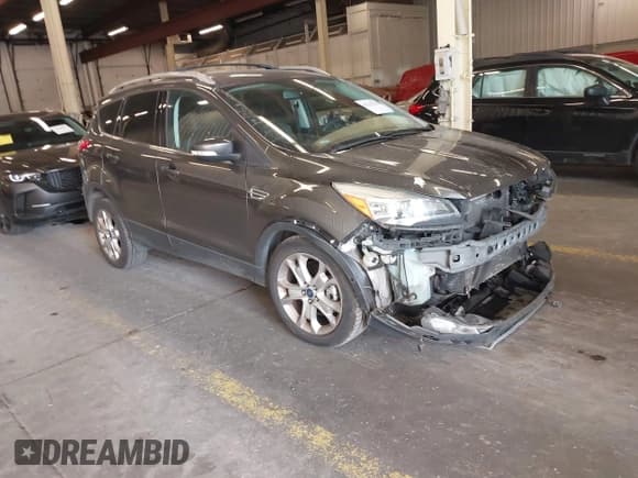 ✅ 2015 Ford Escape Titanium • VIN: 1FMCU9J98FUC05727 • Lot: 42229328. Listed on IAAI with 112,896 mi. Free auction sales archive from the USA and detailed vehicle history report at DreamBid. Image 1.