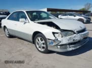 ✅ 2000 Lexus ES 300 • VIN: JT8BF28G4Y5102497 • Лот: 43650282. Опубликован ранее на IAAI с пробегом 128 348 миль. Бесплатный доступ к архиву аукционных продаж из США и подробный отчёт об истории автомобиля на DreamBid. Изображение 1.