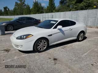 2007 Hyundai Tiburon GS z VIN KMHHM66D67U248918, wystawiony jako Copart lot #77618184 z przebiegiem 145 703 mil mil oraz Szkoda całkowita • Salvage title. Historia ofert i sprzedaży dostępna na DreamBid. Obrazek 1.