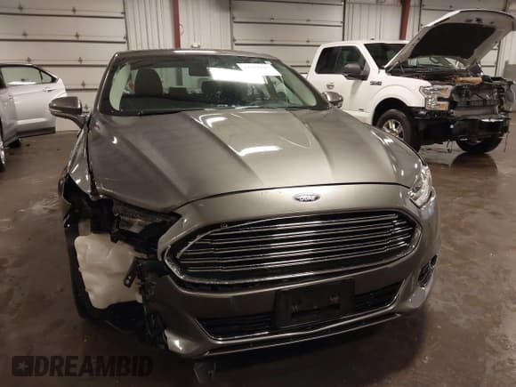 ✅ 2014 Ford Fusion Titanium Hybrid • VIN: 3FA6P0RU1ER217906 • Lot: 42563246. Listed on IAAI with 66,335 mi. Free auction sales archive from the USA and detailed vehicle history report at DreamBid. Image 13.