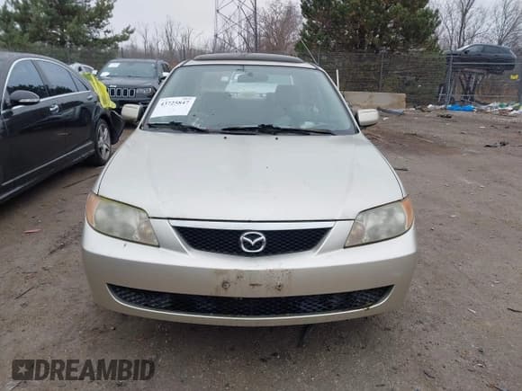 ✅ 2002 Mazda Protege DX • VIN: JM1BJ225121563663 • Lot: 43725847. Wystawiony na IAAI z przebiegiem 120 456 mil. Bezpłatny archiwum sprzedaży aukcyjnych z USA i szczegółowy raport historii pojazdu na DreamBid. Zdjęcie 6.