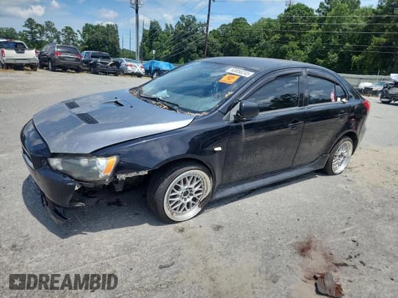 ✅ 2014 Mitsubishi Lancer ES • VIN: JA32X2HU7EU011678 • Lot: 63856245. Listed on Copart with 78,900 mi. Free auction sales archive from the USA and detailed vehicle history report at DreamBid. Image 1.