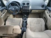 ✅ 2013 Suzuki SX4 LE • VIN: JS2YC5A37D6101979 • Лот: 42185855. Опубликован ранее на Copart с пробегом 118 855 миль. Бесплатный доступ к архиву аукционных продаж из США и подробный отчёт об истории автомобиля на DreamBid. Изображение 8.