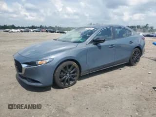 ✅ 2022 Mazda 3 Carbon Edition • VIN: 3MZBPACL9NM310567 • Lot: 65938255. Listed on Copart with 84,879 mi. Free auction sales archive from the USA and detailed vehicle history report at DreamBid. Image 1.