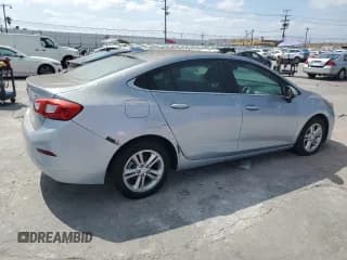 ✅ 2018 Chevrolet Cruze LT • VIN: 1G1BE5SM2J7114834 • Lot: 80557205. Listed on Copart with 131,256 mi. Free auction sales archive from the USA and detailed vehicle history report at DreamBid. Image 3.