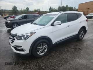 2018 Hyundai Santa Fe 2.4L z VIN 5NMZUDLB2JH101462, wystawiony jako Copart lot #84201535 z przebiegiem 183 614 mil mil oraz Czysty tytuł • Clean title. Historia ofert i sprzedaży dostępna na DreamBid. Obrazek 1.