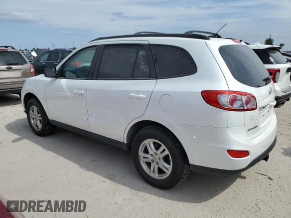 ✅ 2012 Hyundai Santa Fe GLS • VIN: 5XYZGDAB7CG097500 • Lot: 76201154. Listed on Copart with 51,100 mi. Free auction sales archive from the USA and detailed vehicle history report at DreamBid. Image 2.