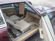 ✅ 1988 Mercedes-Benz 560 SL • VIN: WDBBA48D0JA077921 • Лот: 41450795. Опубликован ранее на IAAI с пробегом 155 749 миль. Бесплатный доступ к архиву аукционных продаж из США и подробный отчёт об истории автомобиля на DreamBid. Изображение 5.