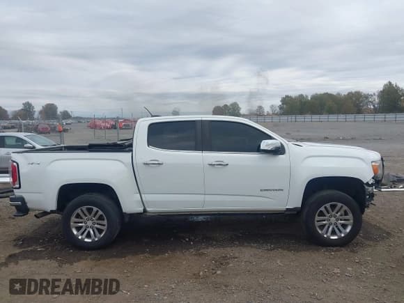 ✅ 2017 GMC Canyon 4WD SLT • VIN: 1GTG6DEN6H1249790 • Лот: 43609704. Опубликован ранее на IAAI с пробегом 141 693 миль. Бесплатный доступ к архиву аукционных продаж из США и подробный отчёт об истории автомобиля на DreamBid. Изображение 14.