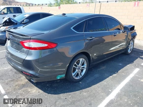 ✅ 2015 Ford Fusion Titanium • VIN: 3FA6P0SU7FR264840 • Lot: 43330907. Listed on IAAI with 126,957 mi. Free auction sales archive from the USA and detailed vehicle history report at DreamBid. Image 4.