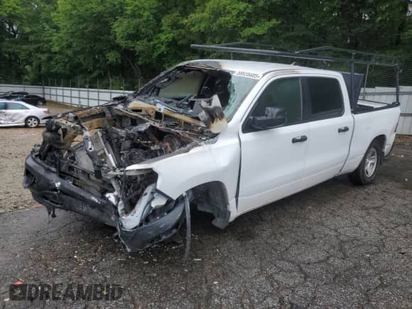 2023 Ram 1500 Tradesman z VIN 1C6RRENT1PN633382, wystawiony jako Copart lot #58935685 z przebiegiem Nie podano mil oraz Szkoda całkowita • Salvage title. Historia ofert i sprzedaży dostępna na DreamBid. Obrazek 1.