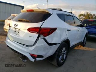 ✅ 2018 Hyundai Santa Fe 2.4L • VIN: 5NMZU3LB0JH053048 • Лот: 69140052. Опубликован ранее на Copart с пробегом 83 445 миль. Бесплатный доступ к архиву аукционных продаж из США и подробный отчёт об истории автомобиля на DreamBid. Изображение 3.