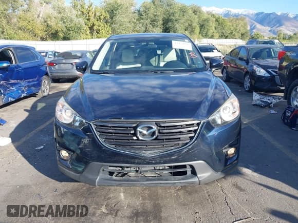 ✅ 2016 Mazda CX-5 Grand Touring • VIN: JM3KE2DY8G0866133 • Лот: 43474326. Опубликован ранее на IAAI с пробегом 164 072 миль. Бесплатный доступ к архиву аукционных продаж из США и подробный отчёт об истории автомобиля на DreamBid. Изображение 12.