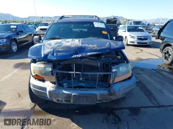 ✅ 2001 Jeep Grand Cherokee Laredo • VIN: 1J4GX48SX1C705230 • Lot: 43292992. Listed on IAAI with 233,950 mi. Free auction sales archive from the USA and detailed vehicle history report at DreamBid. Image 13.