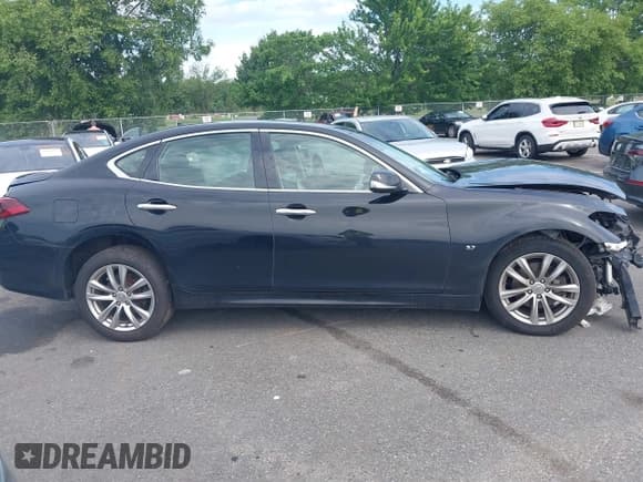 ✅ 2015 Infiniti Q70 • VIN: JN1BY1AR5FM561948 • Lot: 42772368. Wystawiony na IAAI z przebiegiem 132 540 mil. Bezpłatny archiwum sprzedaży aukcyjnych z USA i szczegółowy raport historii pojazdu na DreamBid. Zdjęcie 13.