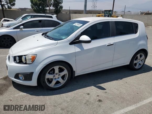✅ 2012 Chevrolet Sonic LTZ • VIN: 1G1JE6SH2C4151651 • Lot: 64218695. Listed on Copart with 102,899 mi. Free auction sales archive from the USA and detailed vehicle history report at DreamBid. Image 1.