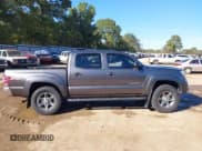 ✅ 2014 Toyota Tacoma PreRunner • VIN: 5TFJU4GN5EX058881 • Lot: 43603920. Listed on IAAI with 170,876 mi. Free auction sales archive from the USA and detailed vehicle history report at DreamBid. Image 14.