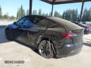 ✅ 2023 Tesla Model Y Long Range • VIN: 7SAYGDEE4PF694216 • Lot: 42180693. Listed on IAAI with 29,303 mi. Free auction sales archive from the USA and detailed vehicle history report at DreamBid. Image 3.