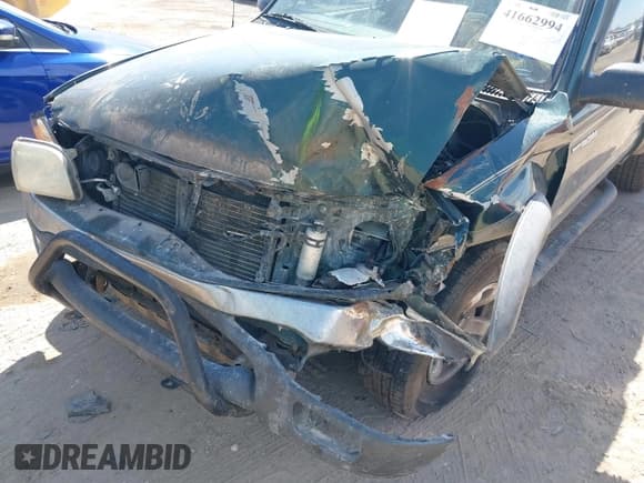 ✅ 2003 Toyota Tacoma PreRunner • VIN: 5TESM92NX3Z298975 • Lot: 41662994. Listed on IAAI with 165,457 mi. Free auction sales archive from the USA and detailed vehicle history report at DreamBid. Image 6.