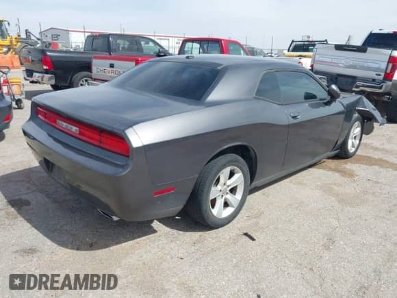 2014 Dodge Challenger SXT 100th Anniversary z VIN 2C3CDYAGXEH298415, wystawiony jako IAAI lot #42133602 z przebiegiem 126 523 mil mil oraz . Historia ofert i sprzedaży dostępna na DreamBid. Obrazek 4.