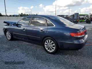2006 Hyundai Azera SE z VIN KMHFC46F76A134376, wystawiony jako Copart lot #79768924 z przebiegiem 215 572 mil mil oraz Nie do naprawy • Non repairable. Historia ofert i sprzedaży dostępna na DreamBid. Obrazek 2.