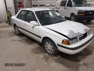 ✅ 1991 Mazda Protege • VIN: JM1BG2267M0278370 • Lot: 41855783. Wystawiony na IAAI z przebiegiem 112 922 mil. Bezpłatny archiwum sprzedaży aukcyjnych z USA i szczegółowy raport historii pojazdu na DreamBid. Zdjęcie 1.