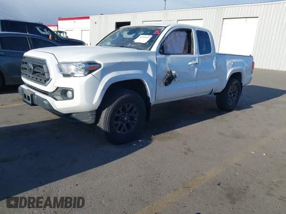 ✅ 2021 Toyota Tacoma SR • VIN: 3TYSZ5ANXMT010581 • Lot: 41933103. Listed on IAAI with 102,828 mi. Free auction sales archive from the USA and detailed vehicle history report at DreamBid. Image 2.