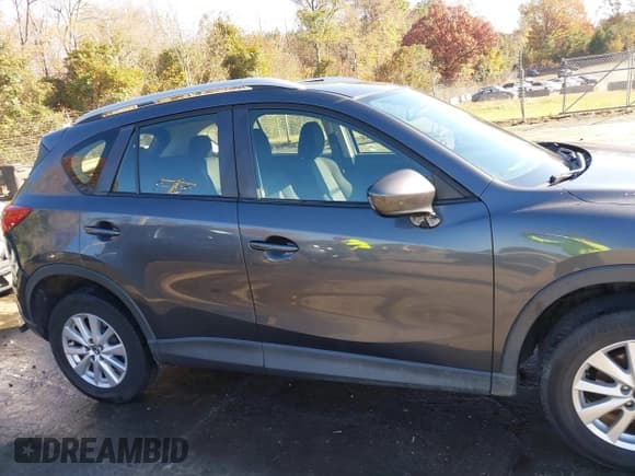 ✅ 2014 Mazda CX-5 Sport • VIN: JM3KE2BE0E0339810 • Lot: 43657362. Listed on IAAI with 198,849 mi. Free auction sales archive from the USA and detailed vehicle history report at DreamBid. Image 13.