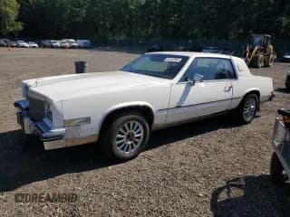 ✅ 1985 Cadillac Eldorado • VIN: 1G6EL5780FE669454 • Lot: 65182565. Wystawiony na Copart z przebiegiem 64 638 mil. Bezpłatny archiwum sprzedaży aukcyjnych z USA i szczegółowy raport historii pojazdu na DreamBid. Zdjęcie 1.